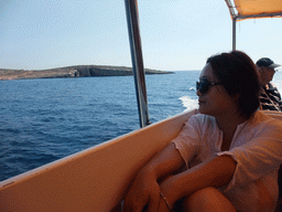 Miaomiao on the Luzzu Cruises tour boat from Comino to Malta, with a view on the north coast of Comino