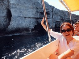 Miaomiao on the Luzzu Cruises tour boat from Comino to Malta, with a view on the Crystal Caves at the north coast of Comino
