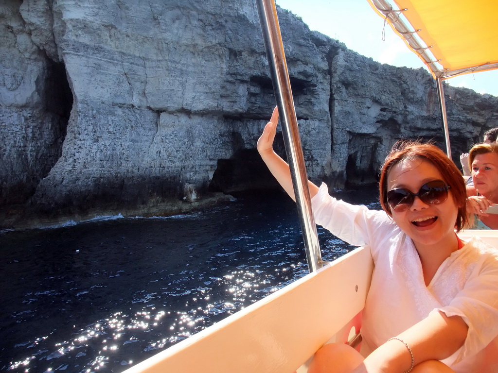 Miaomiao on the Luzzu Cruises tour boat from Comino to Malta, with a view on the Crystal Caves at the north coast of Comino