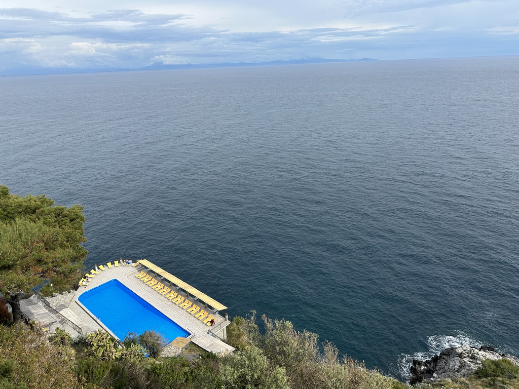 Swimming pool of Hotel Belvedere and the Tyrrhenian Sea, viewed from the parking lot