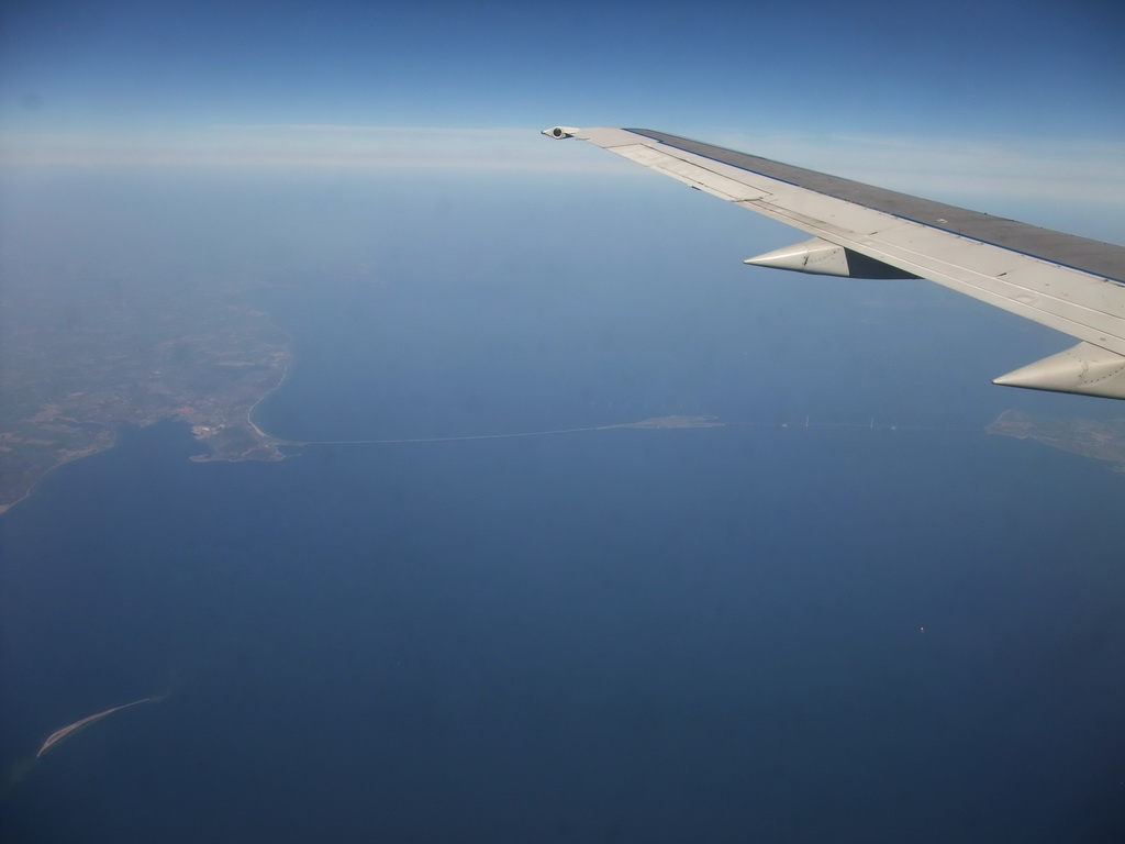 View on the Storebæltsforbindelsen (Great Belt Fixed Link) and the Storebæltsbroen (Great Belt Bridge) over the Great Belt strait, from our airplane from Amsterdam to Copenhagen