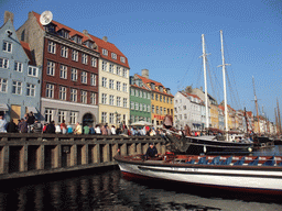 Boats, houses and restaurants at the north side of the Nyhavn harbour, viewed from the DFDS Canal Tours boat