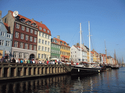 Boats, houses and restaurants at the north side of the Nyhavn harbour, viewed from the DFDS Canal Tours boat