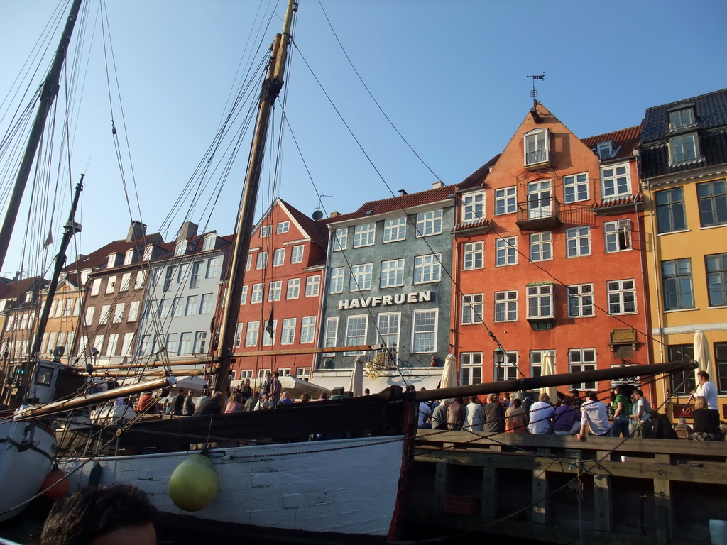 Boats, houses and restaurants at the north side of the Nyhavn harbour, viewed from the DFDS Canal Tours boat