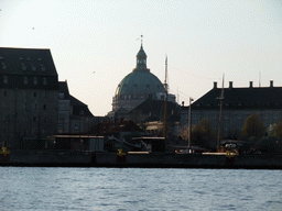 The Amalienborg Palace (Amalienborg Slot) and the dome of the Frederik`s Church (Frederiks Kirke) or Marble Church (Marmorkirken), viewed from the DFDS Canal Tours boat