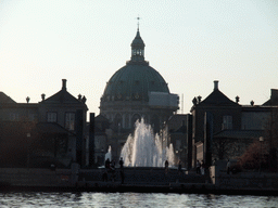 Fountain at the Amaliehaven garden of the Amalienborg Palace, and the dome of the Frederik`s Church, viewed from the DFDS Canal Tours boat