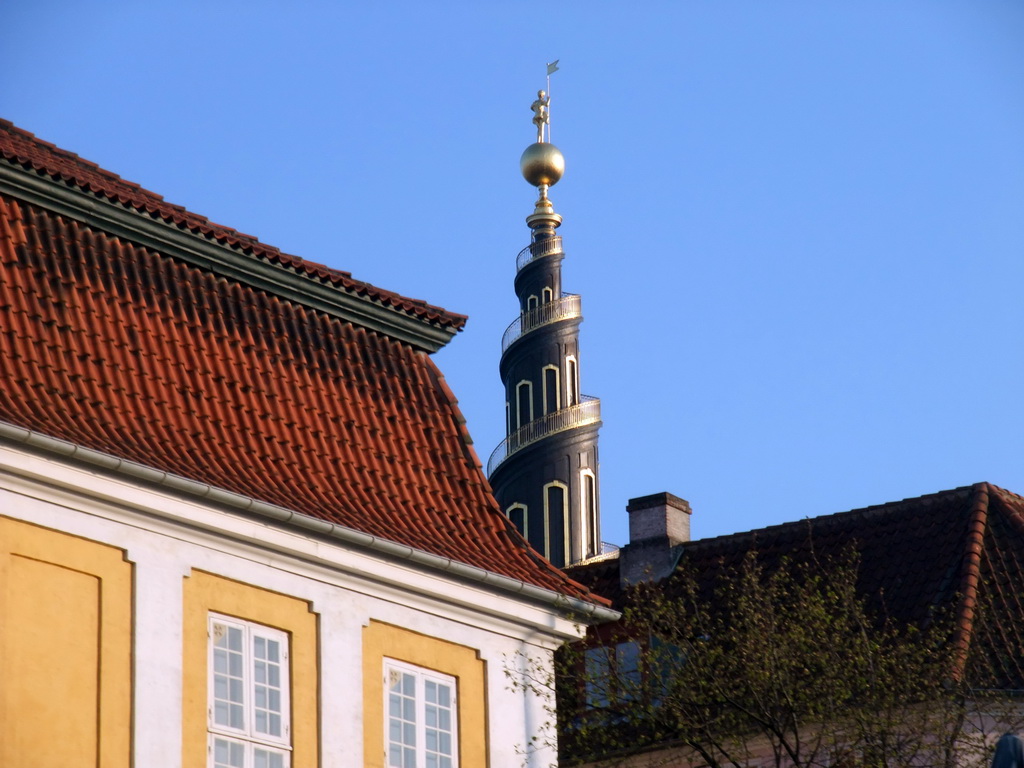 The tower of the Church of Our Saviour and houses in the Christianshavn neighbourhood, viewed from the DFDS Canal Tours boat