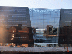 The Black Diamond building of the Royal Danish Library, with reflections of other buildings, viewed from the DFDS Canal Tours boat