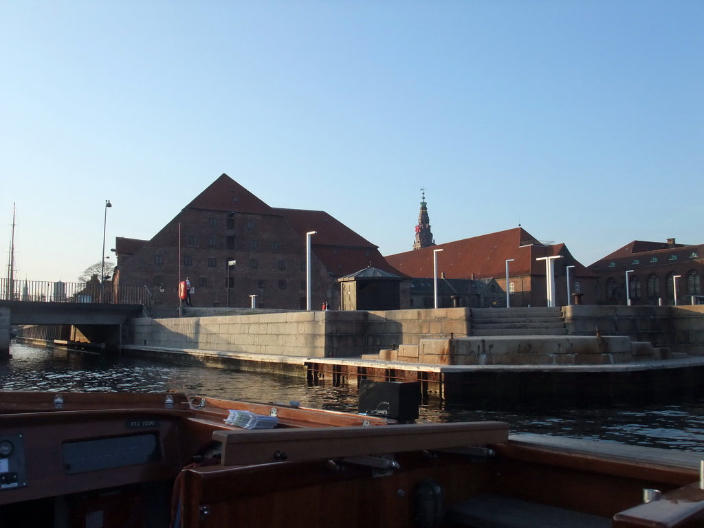 Christians Brygge quay with Christian IV`s Brewhouse (Christian IV`s Bryghus), the Tøjhus Museum, the Royal Danish Library and the Christiansborg Palace Tower, viewed from the DFDS Canal Tours boat