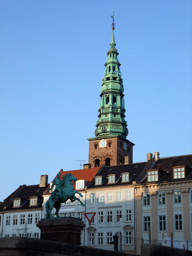Houses and the equestrian statue of Absalon at Højbro Plads square, and the tower of the Saint Nicholas Church, viewed from the DFDS Canal Tours boat
