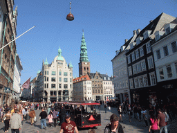 The Amagertorv square with the Stork Fountain, the tower of the Saint Nicholas Church and a tourist train