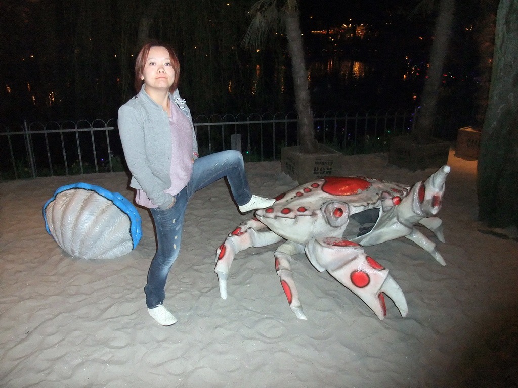 Miaomiao with giant crab at the Tivoli Gardens, by night