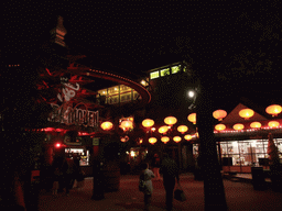 Street with lanterns below the attraction `The Demon` at the Tivoli Gardens, by night