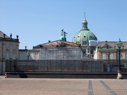 The equestrian statue of King Frederick V at Amalienborg Palace, under renovation, and the dome of Frederik`s Church