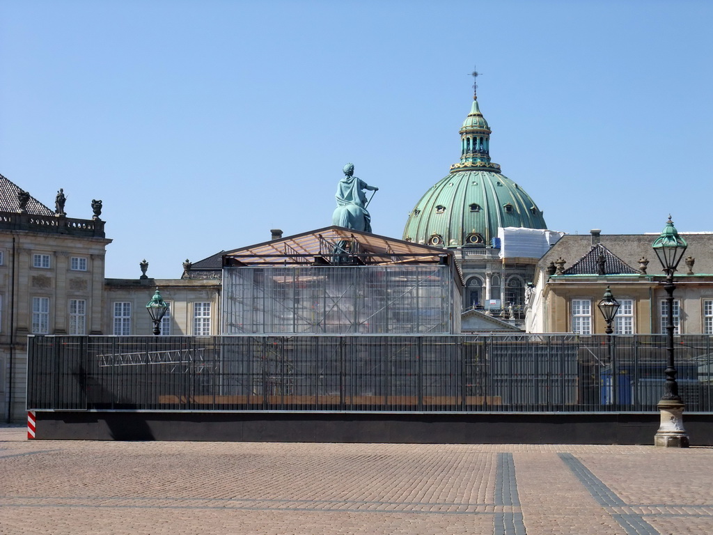The equestrian statue of King Frederick V at Amalienborg Palace, under renovation, and the dome of Frederik`s Church