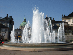 Fountain at the Amaliehaven garden of the Amalienborg Palace, and the dome of the Frederik`s Church