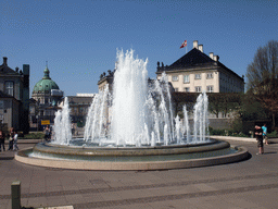 Fountain at the Amaliehaven garden of the Amalienborg Palace, and the dome of the Frederik`s Church