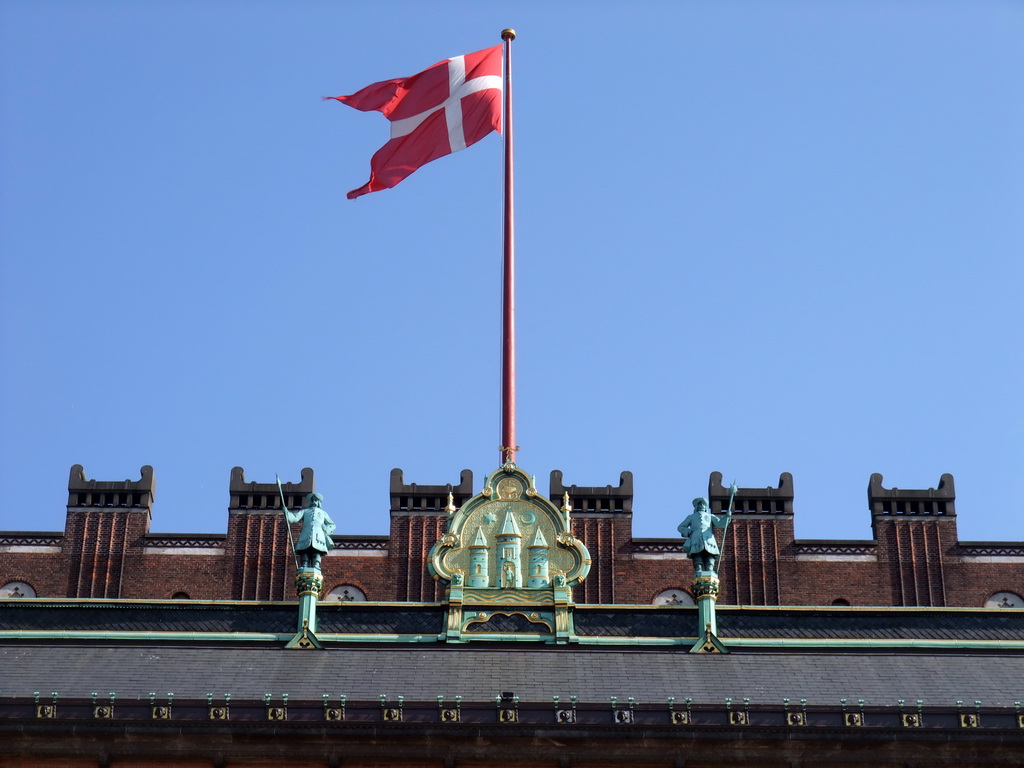 Flag and statues on top of the Copenhagen City Hall