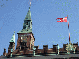Tower, flag and statues on top of the Copenhagen City Hall