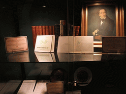 Books and portrait of Hans Christian Andersen in the H.C. Andersen Eventyrhuset museum