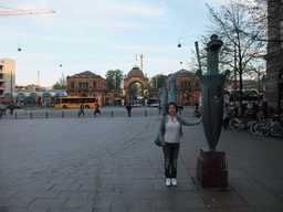 Miaomiao with statues at Axeltorv square and the main entrance to the Tivoli Gardens