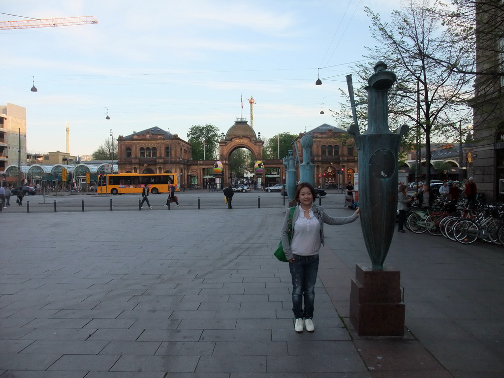 Miaomiao with statues at Axeltorv square and the main entrance to the Tivoli Gardens