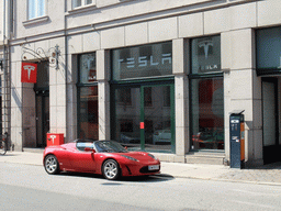 Tesla sports car in front of the Tesla store at Bredgade street