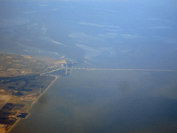 The west side of the Afsluitdijk causeway, the Wadden Sea and the IJsselmeer lake, viewed from the airplane from Amsterdam