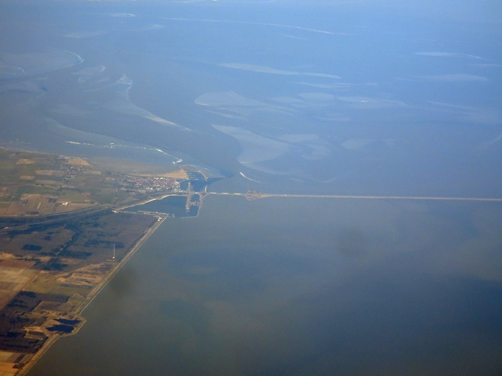The west side of the Afsluitdijk causeway, the Wadden Sea and the IJsselmeer lake, viewed from the airplane from Amsterdam