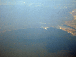 The east side of the Afsluitdijk causeway, the Wadden Sea and the IJsselmeer lake, viewed from the airplane from Amsterdam