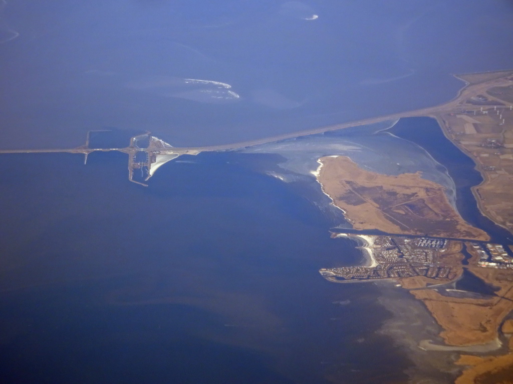 The east side of the Afsluitdijk causeway, the town of Makkum, the Wadden Sea and the IJsselmeer lake, viewed from the airplane from Amsterdam