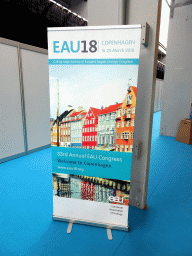 Poster for the EAU18 conference in the lobby of the Bella Center