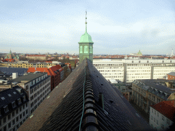 The roof and tower of the Trinitatis Church, the Rosenborg Castle and the dome of Frederik`s Church, viewed from the ramp of the Rundetaarn tower