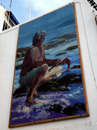 Painting on a house at the Calle El Muelle street, at sunset