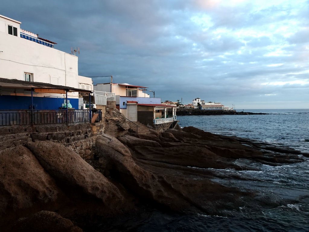 Houses at the Playa La Caleta beach, at sunset