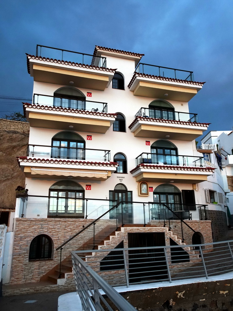 Front of a building at the Calle El Muelle street, at sunset