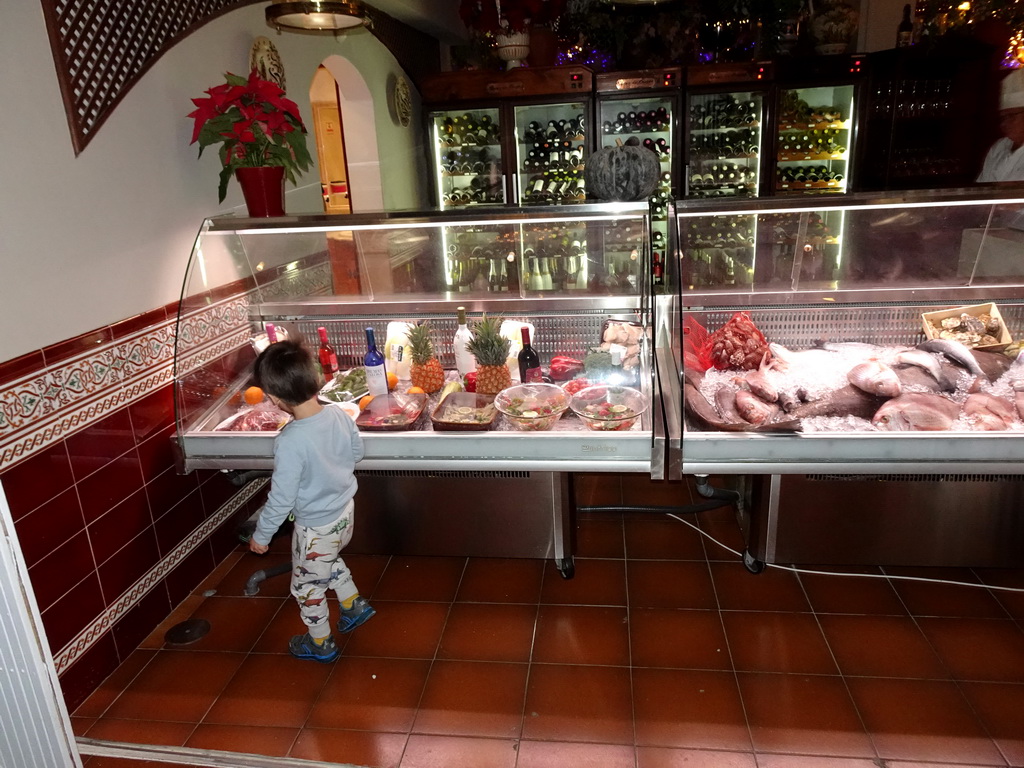 Max at the front of the La Masia del Mar restaurant at the Calle El Muelle street