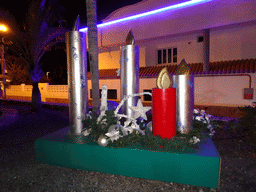 Candle statues at the park at the east side of the Calle El Muelle street, by night