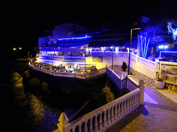 Front of the Restaurante Piscis Terraza, viewed from the playground at the Calle los Pescadores street, by night