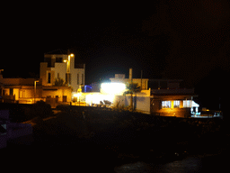 Restaurants at the Calle los Pescadores street, viewed from the playground, by night