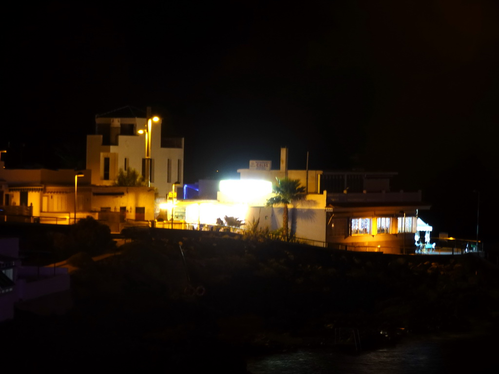 Restaurants at the Calle los Pescadores street, viewed from the playground, by night