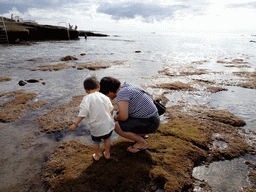 Miaomiao and Max looking at a Sea Hare at the Playa El Varadero beach
