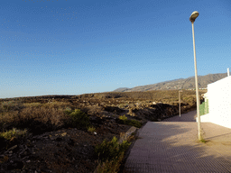 Northeast side of the street behind the Beachfront Apartments in Costa Adeje, and the La Cueva hill