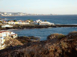 The Playa La Caleta beach and restaurants at the Calle los Pescadores street, viewed from the La Cueva hill