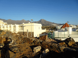 Apartment buildings and the Roque del Conde mountain, viewed from the La Cueva hill