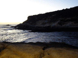 The Playa La Caleta beach and the La Cueva hill, at sunset