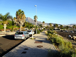 The Avenida de los Acantilados street and the Roque del Conde mountain