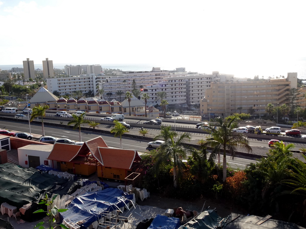 Buildings in the town center and the Autopista del Sur road, viewed from a walking bridge at the Siam Park water theme park