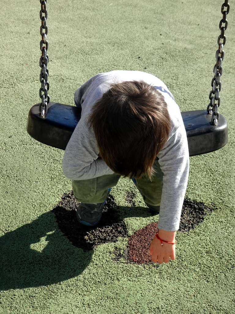 Max on the swing at the playground at the Calle los Pescadores street