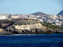 Rocks at the Playa de La Enramada beach and the town center, viewed from the Playa El Cobero beach